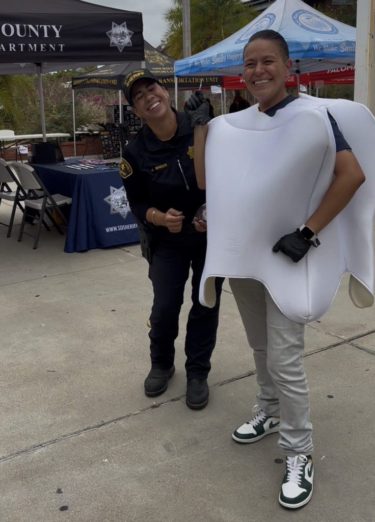 Carla Yriqui of Santa Fe Dental Group and San Marcos Smile Dental wearing a tooth mascot costume